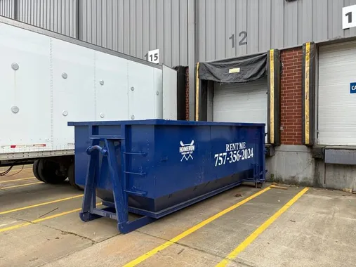 Homerun Hauling blue roll-off dumpster ready for delivery